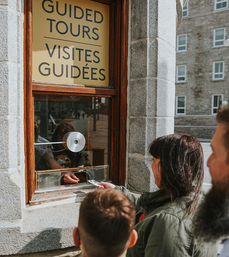 Photo of people buying Guided Tour tickets. Photo of people buying Guided Tour tickets.